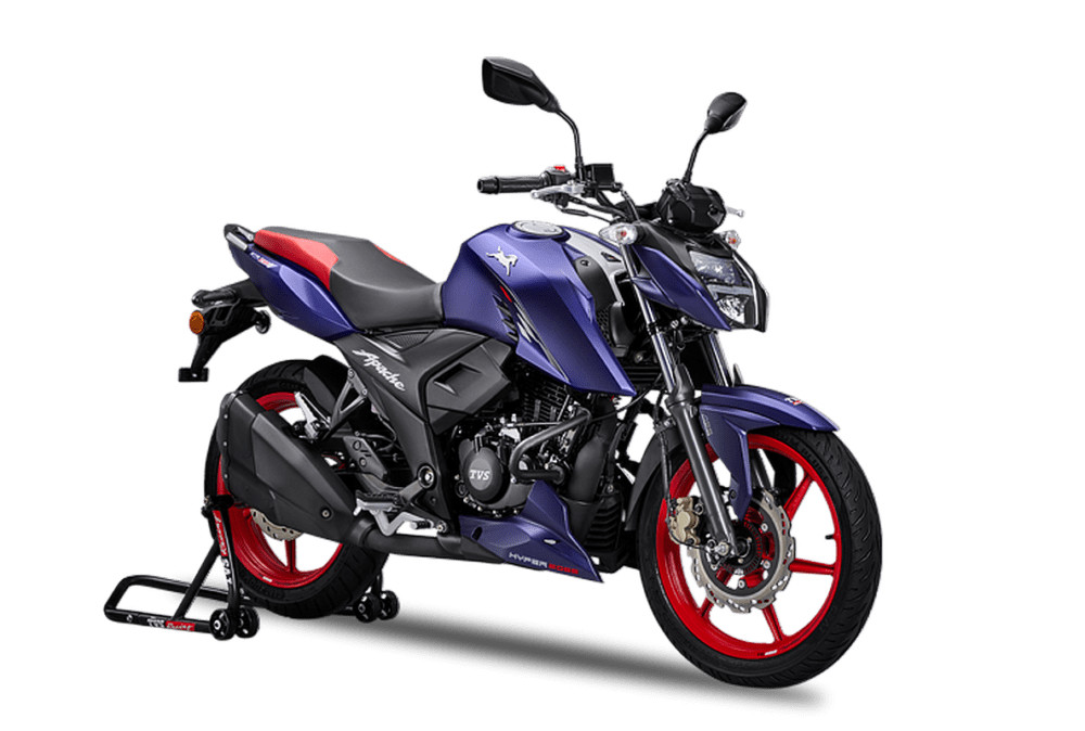 <img src="https://motodinamia.com/wp/wp-content/uploads/2023/12/tvs-rtr-160-4v-2024-mdm-1.jpg" alt="La TVS RTR 160 4V 2024 se presentó en el Motosoul 2023, con una decoración distintiva denominada Lightning Blue que combina violeta con Rojo">