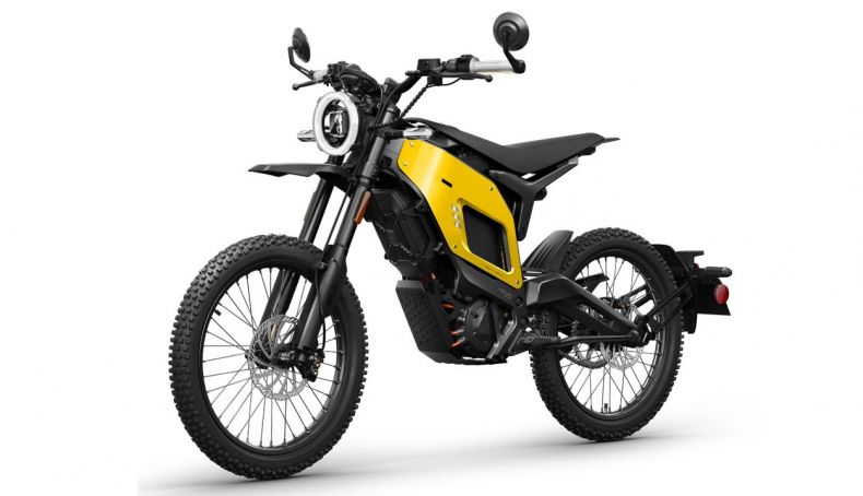 Moto off-road eléctrica amarilla con faro redondo y llantas negras
