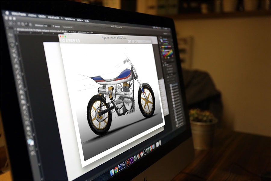 En una monitor de PC se observa una plantilla de personalización de motos con una imagen de una motocross